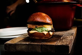 burger on top of brown board