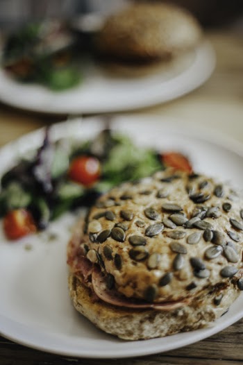 Burger With Sesame Seeds on White Plate