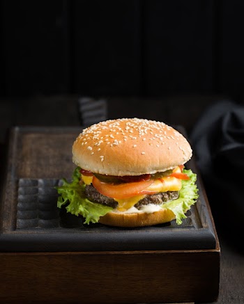 Burger With Sliced Vegetables Close-up Photography