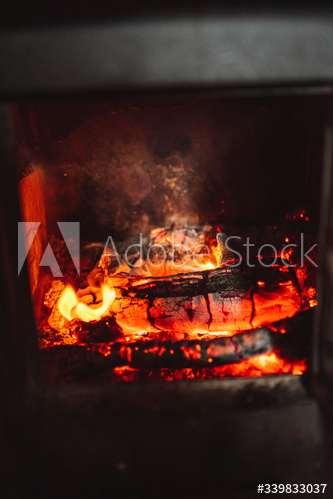Burning firewood in a fireplace