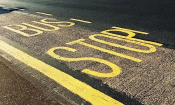 Bus Stop Printed on Asphalt Road