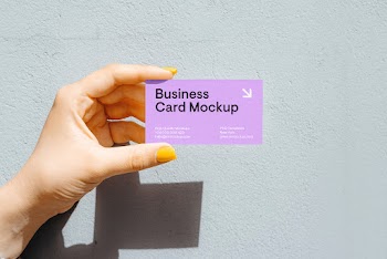 Business Card in Women Hand Mockup