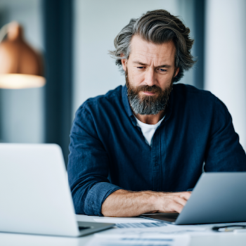 Business Owner Analyzing Financial Documents in Scandinavian Office