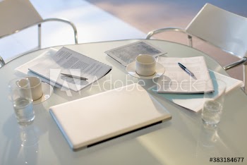 Business paperwork and laptop on office table