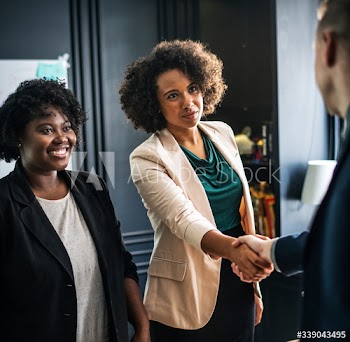 Business partners shaking hands in agreement