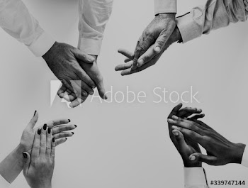 Business people clapping hands together