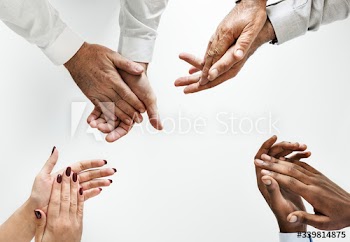 Business people clapping hands together