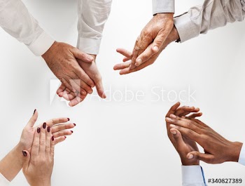 Business people clapping hands together