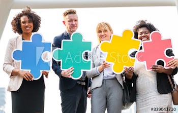 Business people connected by puzzle pieces