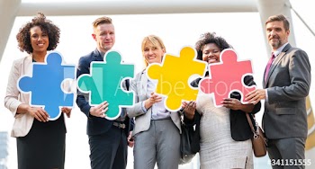 Business people connected by puzzle pieces