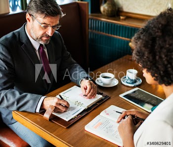 Business people discussing in the cafe