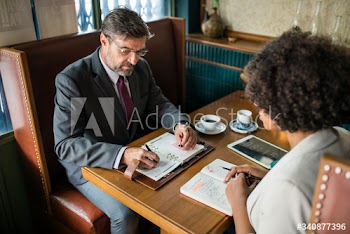 Business people discussing in the cafe