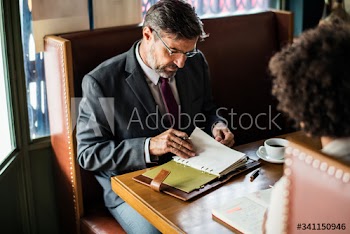 Business people discussing in the cafe