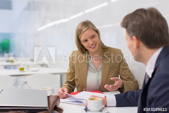 Business people discussing paperwork in meeting