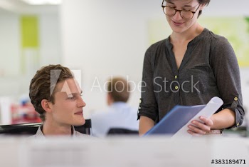 Business people discussing paperwork in office