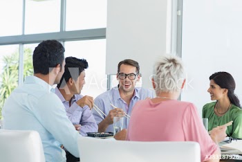 Business people enjoying sushi lunch meeting