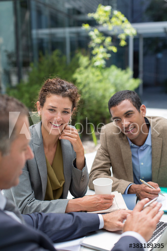 Business people meeting at outdoor cafe