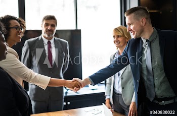 Business people shaking hands in a meeting room