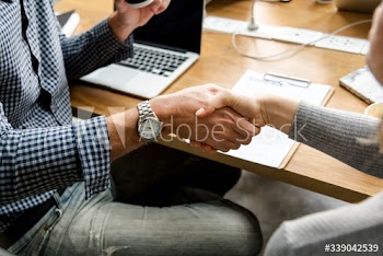 Business people shaking hands in agreement