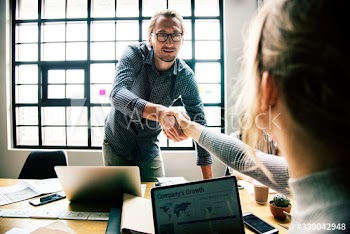Business people shaking hands in agreement