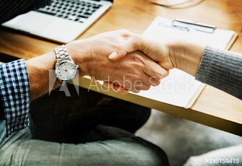 Business people shaking hands in agreement