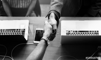 Business people shaking hands in agreement