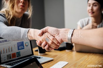 Business people shaking hands in agreement