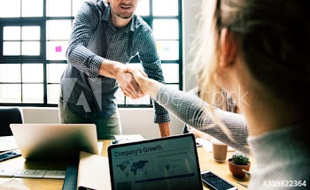 Business people shaking hands in agreement