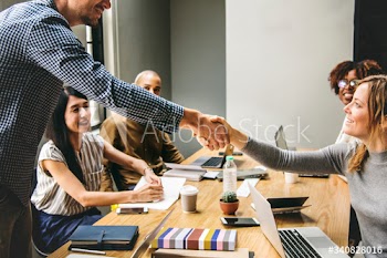 Business people shaking hands in agreement