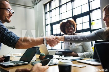 Business people shaking hands in agreement