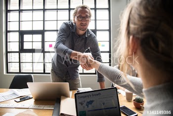 Business people shaking hands in agreement