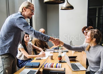 Business people shaking hands in agreement