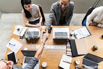 Business people shaking hands in agreement