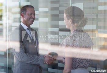 Business people shaking hands in office