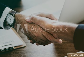Business people shaking hands together