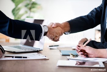 Business people shaking hands together