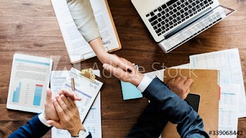 Business people shaking their hands