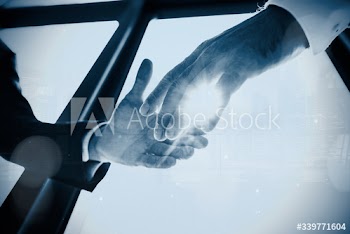 Business people shaking their hands