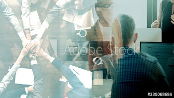 Business people stacking their hands