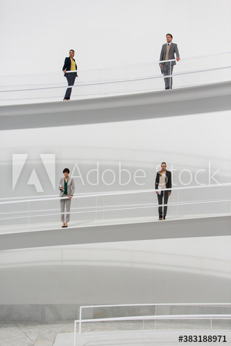 Business people standing on modern ramps