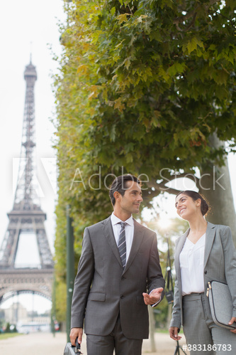 Business people talking, Eiffel Tower, Paris, France