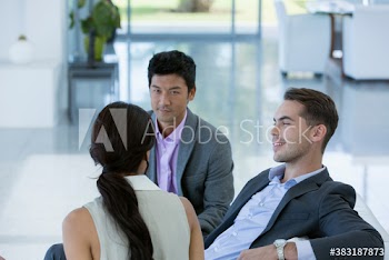 Business people talking in lobby
