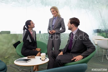 Business people talking in modern office meeting