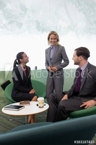 Business people talking in modern office meeting