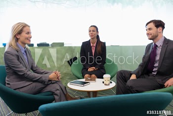 Business people talking in modern office meeting