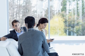 Business people talking on sofa