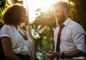 Business people talking together in the park