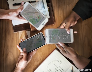 Business people using maps on phones