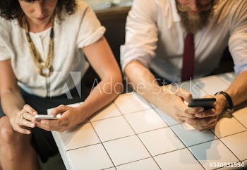 Business People using the phone at coffee shop