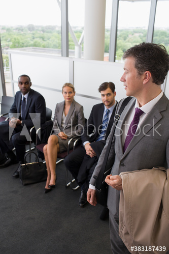 Business people waiting in office lobby